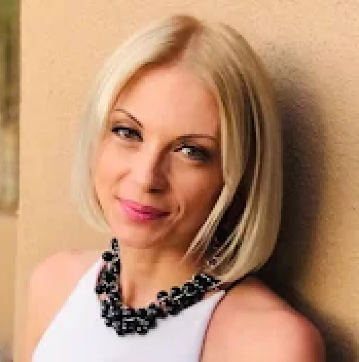 photo of a woman looking at camera - business portrait of a client